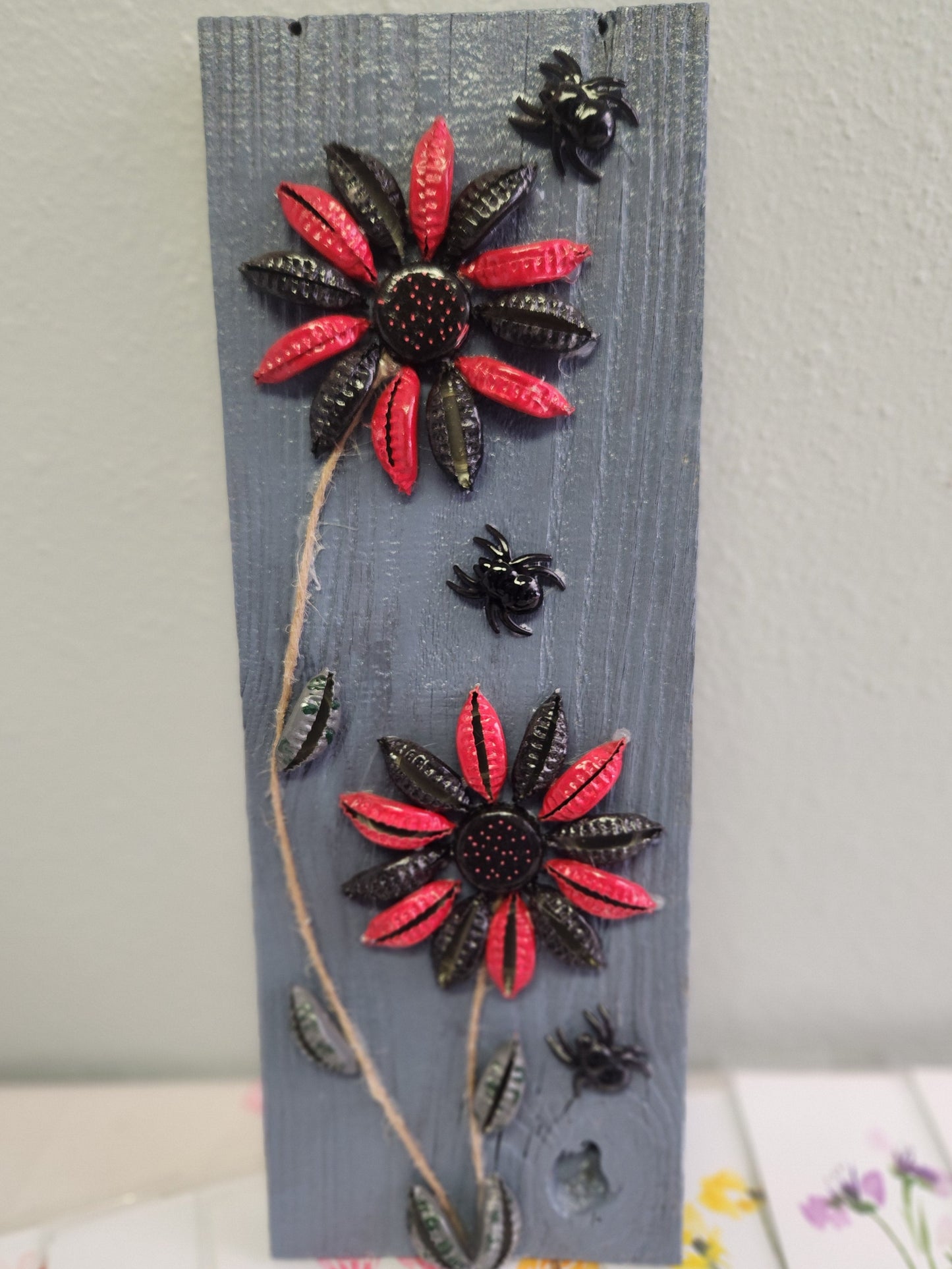 Bottle Cap Flowers with Spiders on Rustic Wood